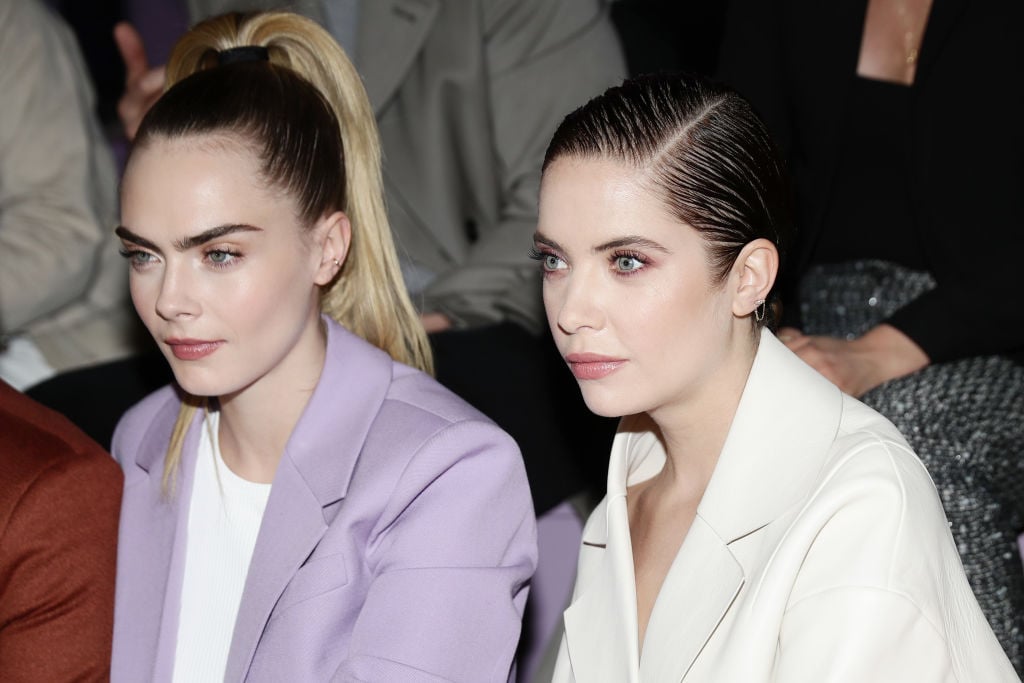 Cara Delevingne and Ashley Benson attend the BOSS fashion show during the Milan Fashion Week Fall/Winter 2020 - 2021 on February 23, 2020