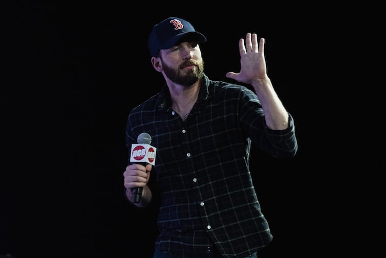 Chris Evans speaks on stage