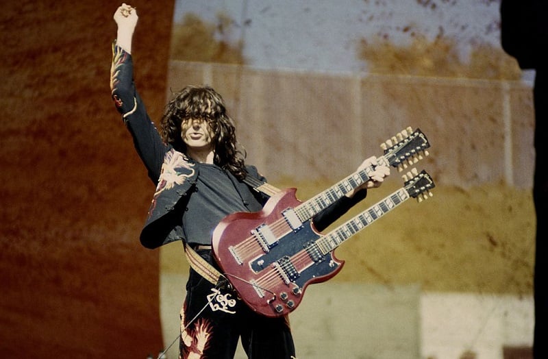 Jimmy Page performing with a double-neck guitar