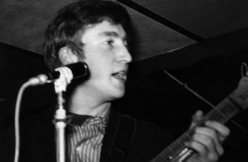 John Lennon onstage in early Beatles days