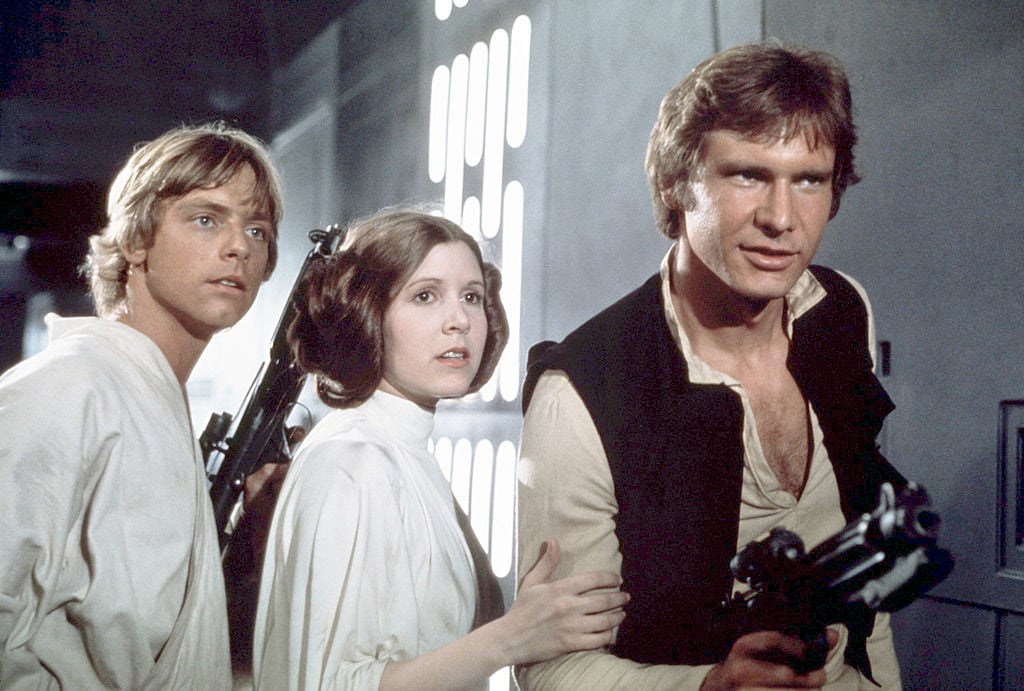 Mark Hamill, Carrie Fisher, and Harrison Ford on the set of 'Star Wars: Episode IV - A New Hope.'