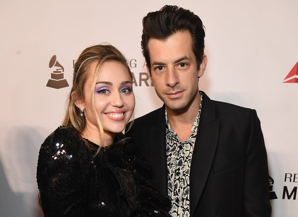 Miley Cyrus (L) and Mark Ronson attend MusiCares Person of the Year honoring Dolly Parton on February 8, 2019