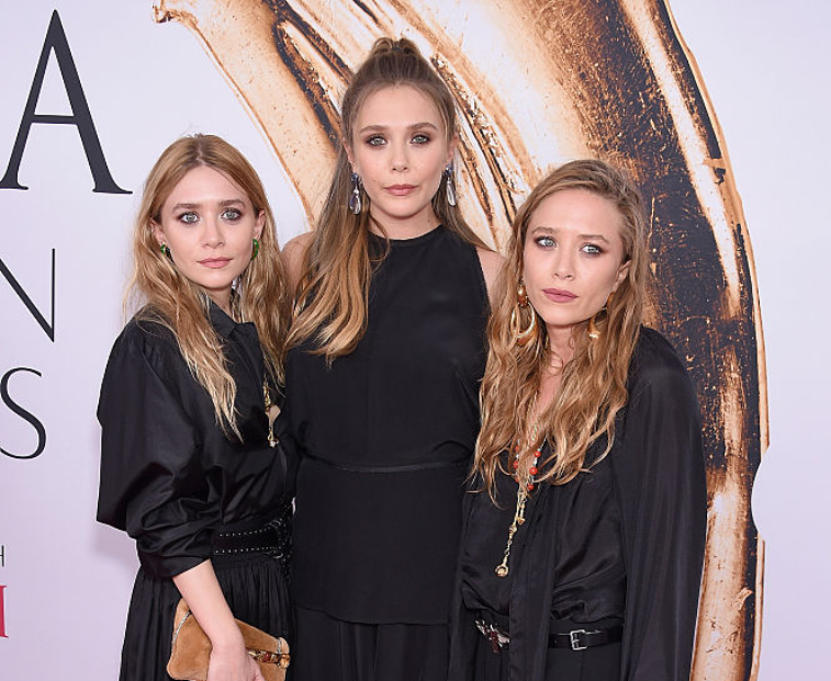 Elizabeth Olsen with sisters Mary-Kate and Ashley Olsen