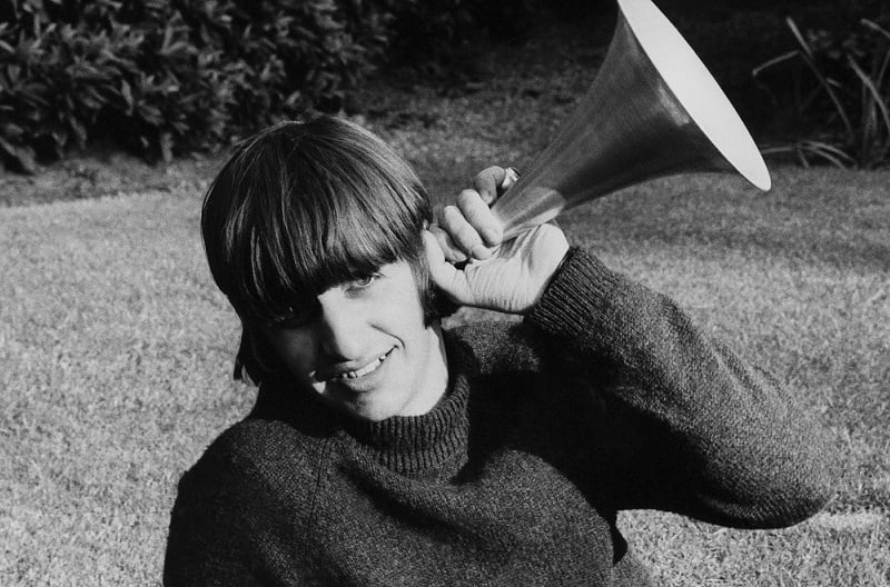 Ringo Starr poses in a garden, circa 1964