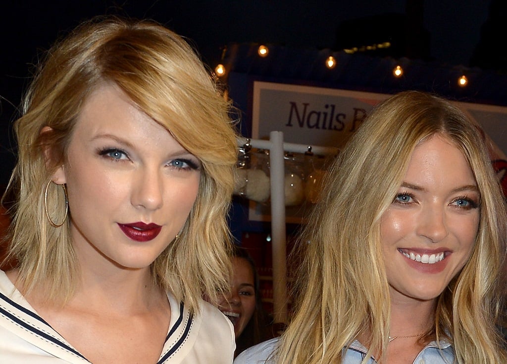Taylor Swift and Martha Hunt attend the #TOMMYNOW Women's Fashion Show during New York Fashion Week at Pier 16 on September 9, 2016 in New York City.