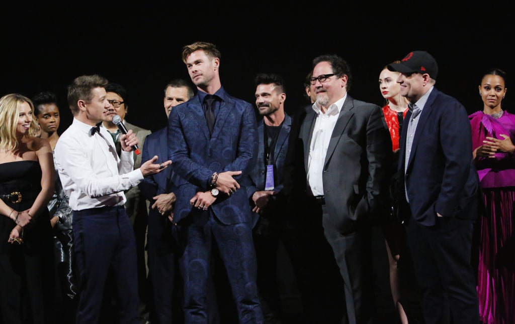 (L-R) Scarlett Johansson, Jeremy Renner, Chris Hemsworth, Executive producer Jon Favreau, and President of Marvel Studios/Producer Kevin Feige speak onstage
