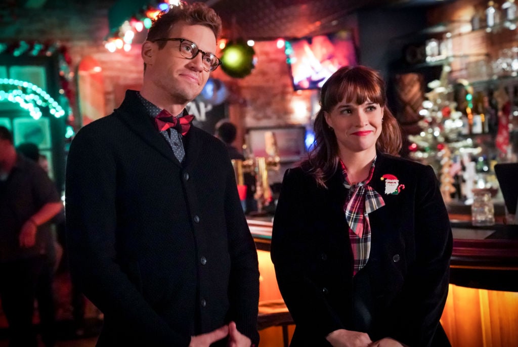 Barrett Foa (Tech Operator Eric Beale) and Renée Felice Smith (Intelligence Analyst Nell Jones on the set of NCIS LA 