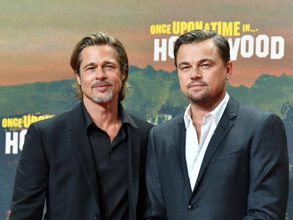 Brad Pitt (l) and Leonardo DiCaprio come to the premiere of their movie 'Once upon a time...in Hollywood'
