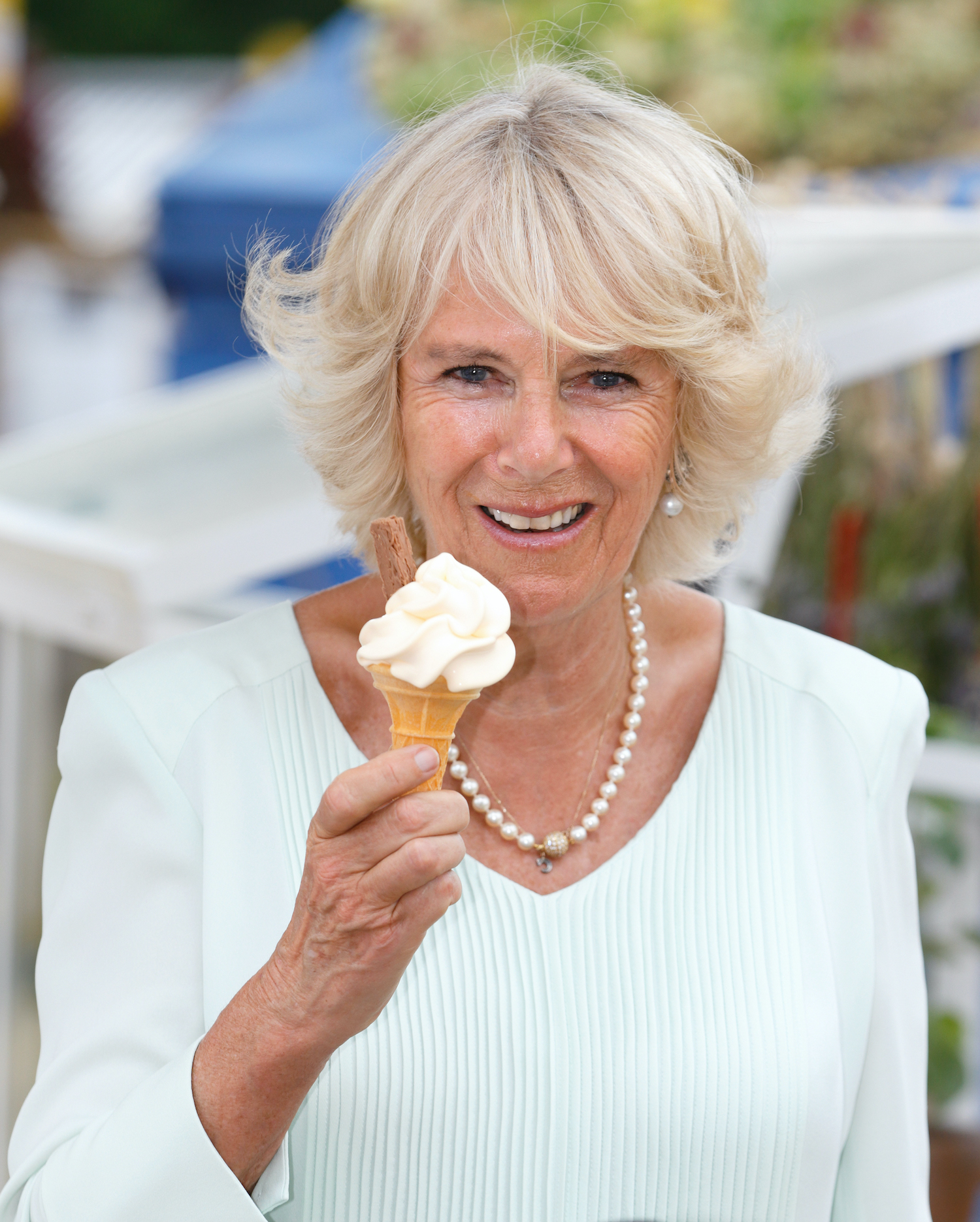 Camilla Parker Bowles eats ice cream at the Hampton Court Flower Show