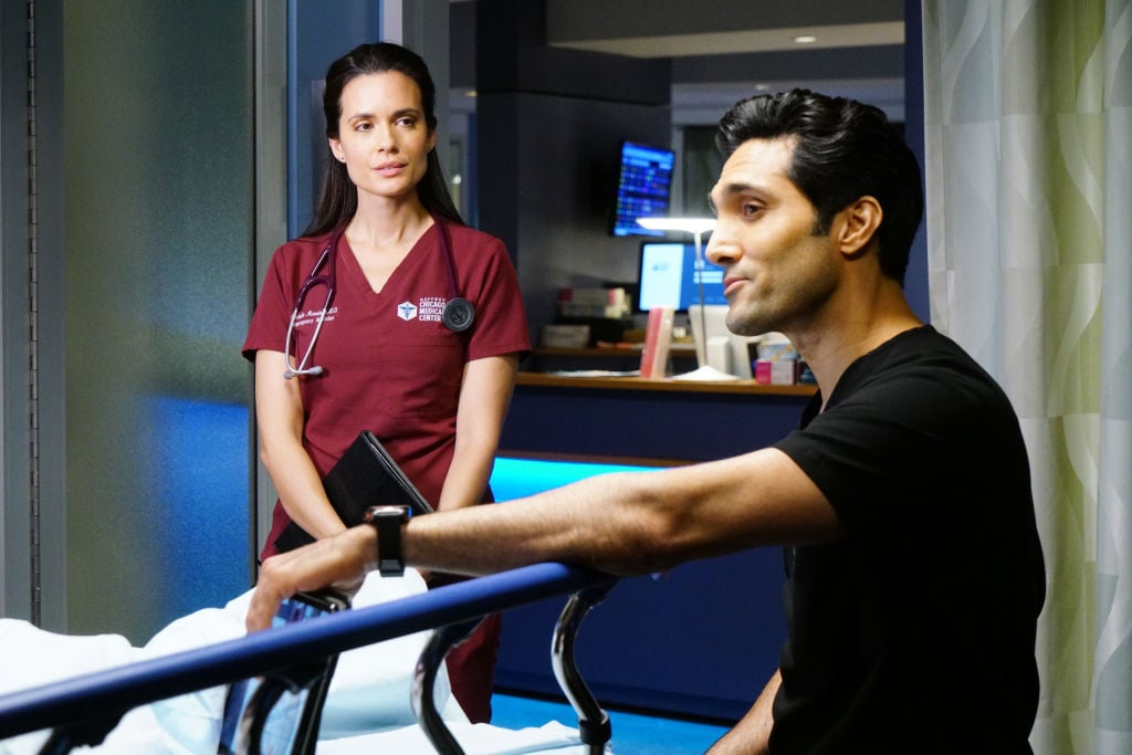 Torrey DeVitto as Natalie Manning, Dominic Rains as Crockett Marcel working over a gurney on 'Chicago Med'