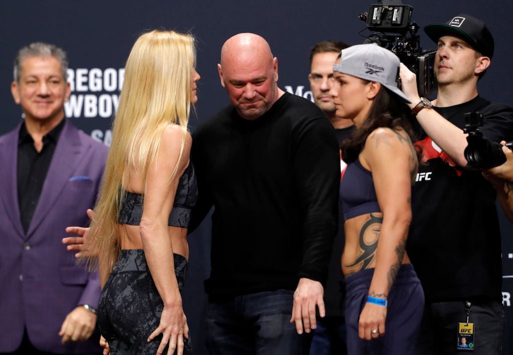 UFC president Dana White separates bantamweight fighters Holly Holm (L) and Raquel Pennington as they face off during a ceremonial weigh-in for UFC 246 at Park Theater at Park MGM 