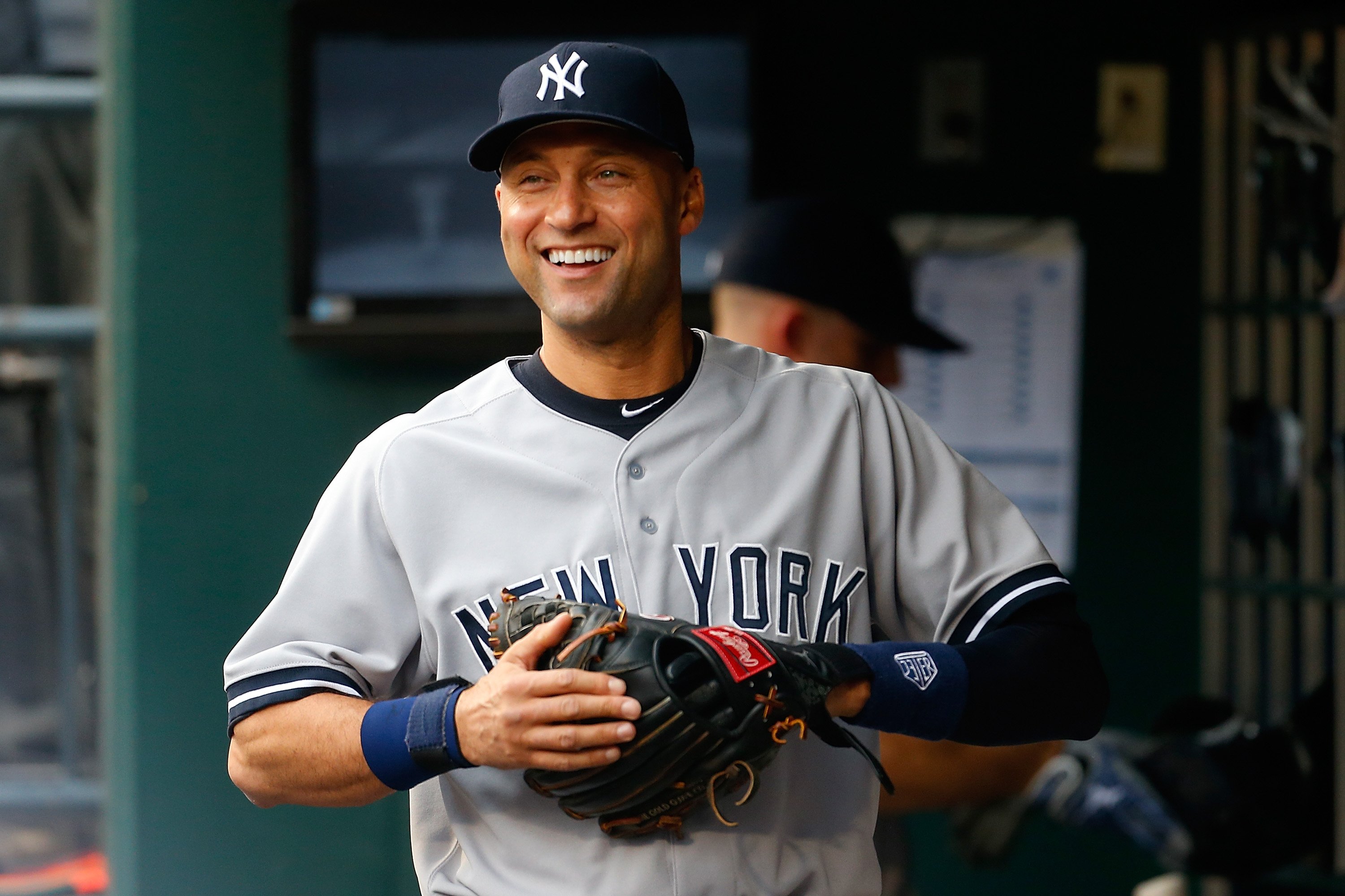 Derek Jeter smiling in the dugout