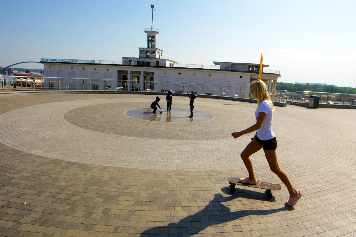 A woman skateboarding in a park