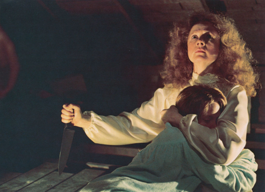 Piper Laurie (with knife) and Sissy Spacek star in the film 'Carrie'