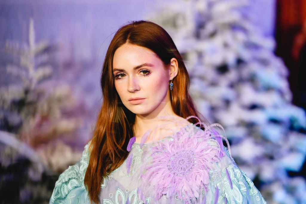 Karen Gillan looking off camera, not smiling