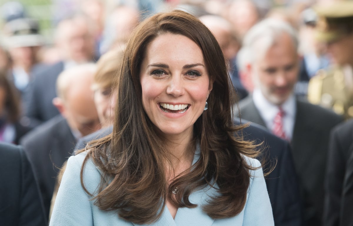 Kate Middleton smiling in front of a crowd