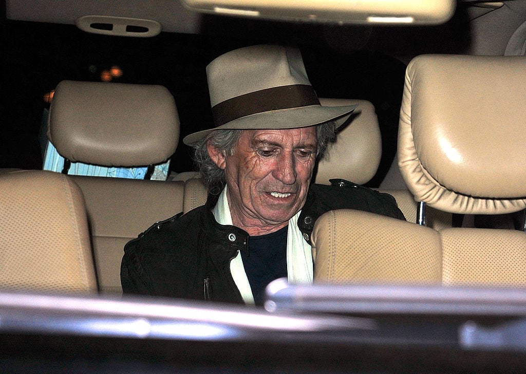 Keith Richards in the back of a car