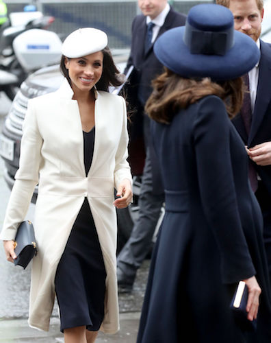 Meghan Markle smiles at Kate Middleton