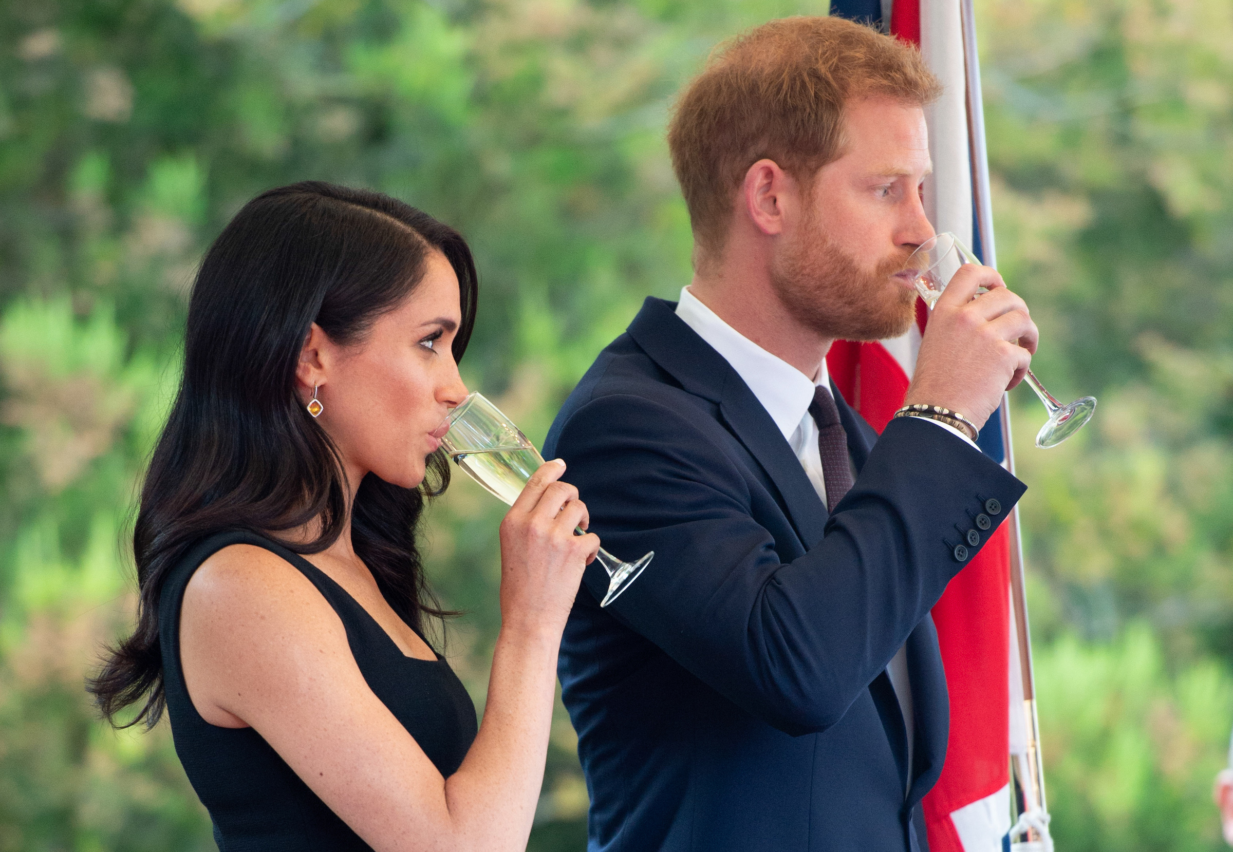Meghan Markle and Prince Harry toast with champagne while in Ireland