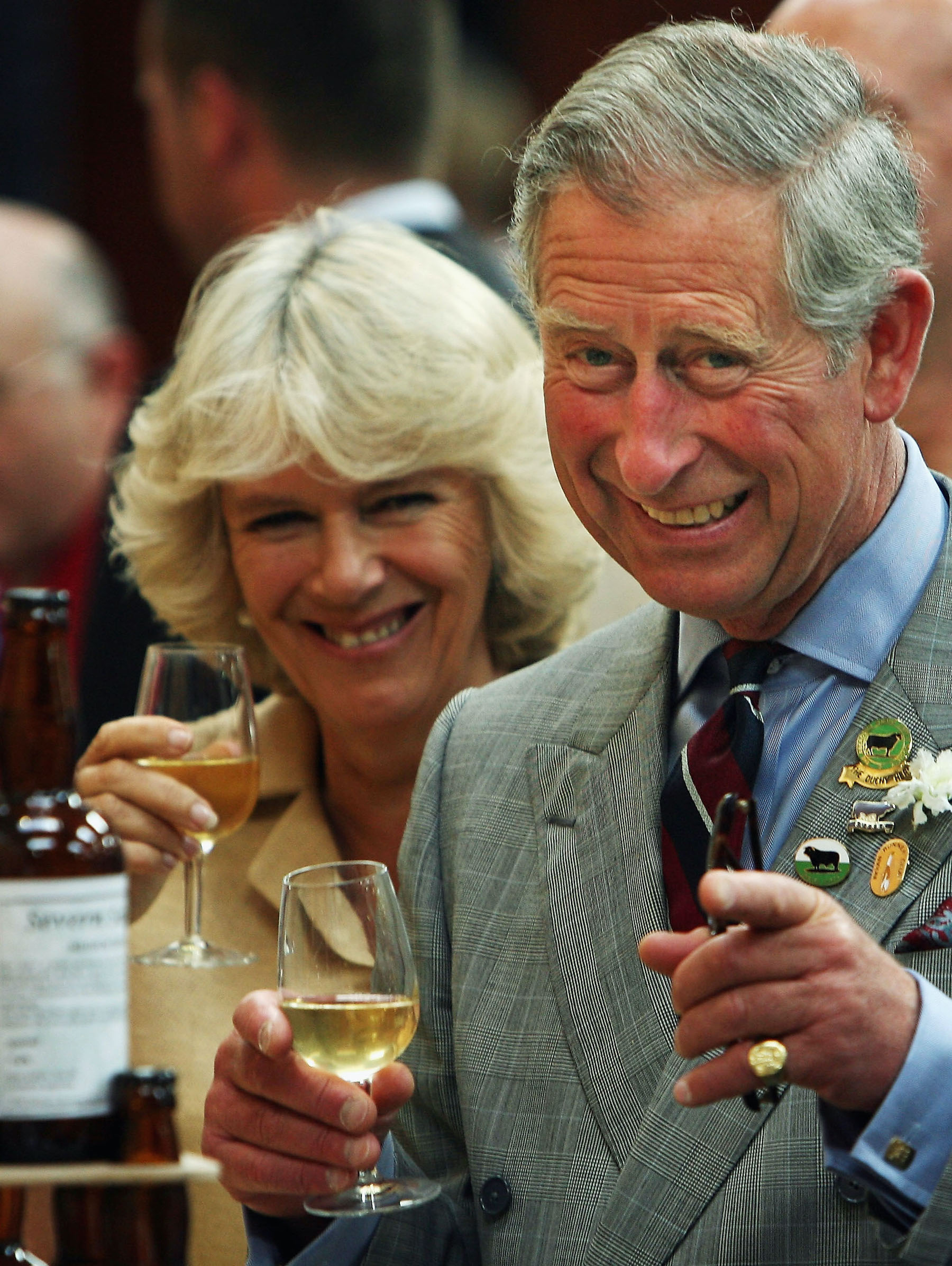 Prince Charles and Camilla Parker Bowles drink wine at an agricultural show