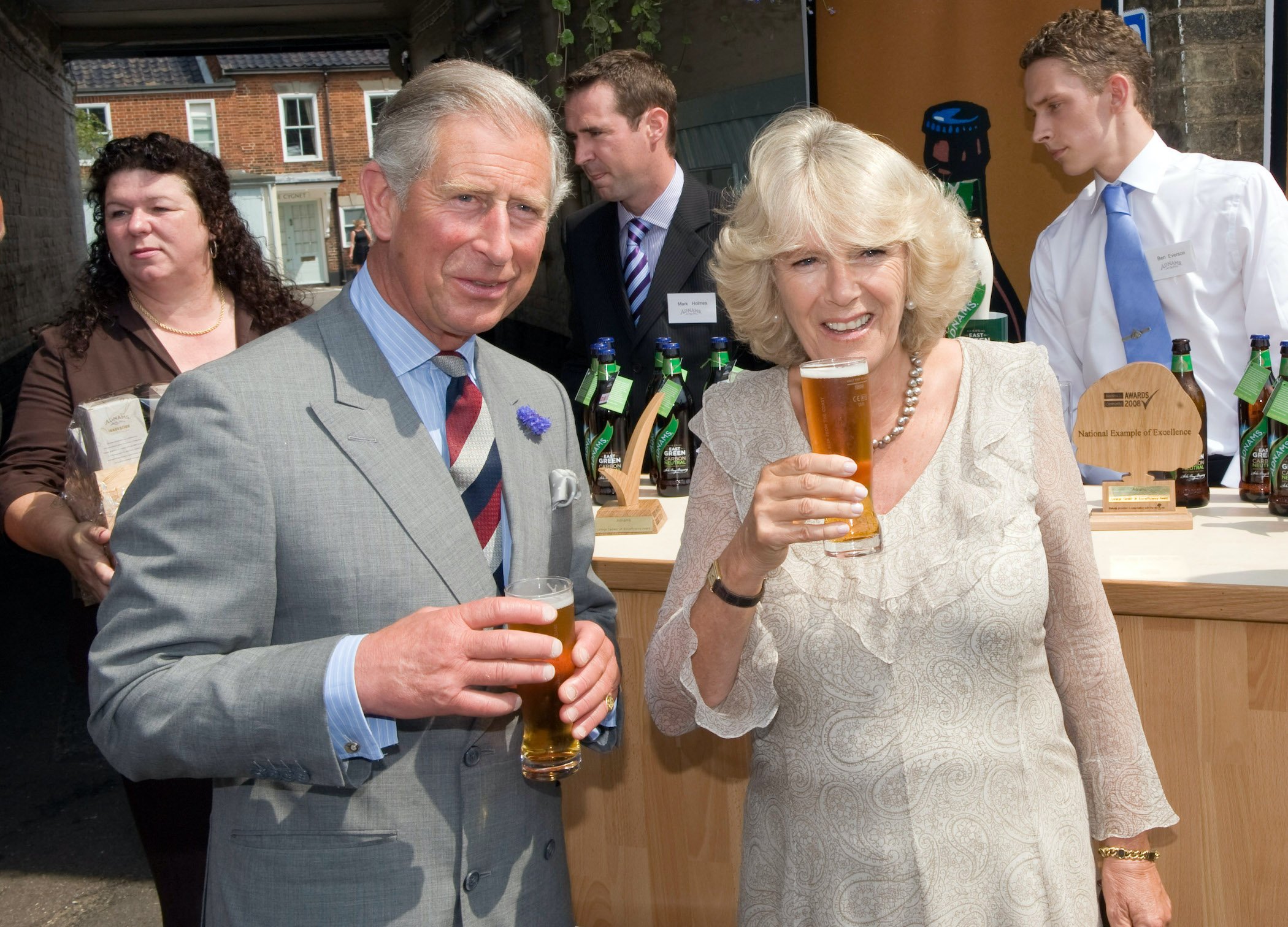Prince Charles and Camilla Parker Bowles drink beer during a visit Suffolk