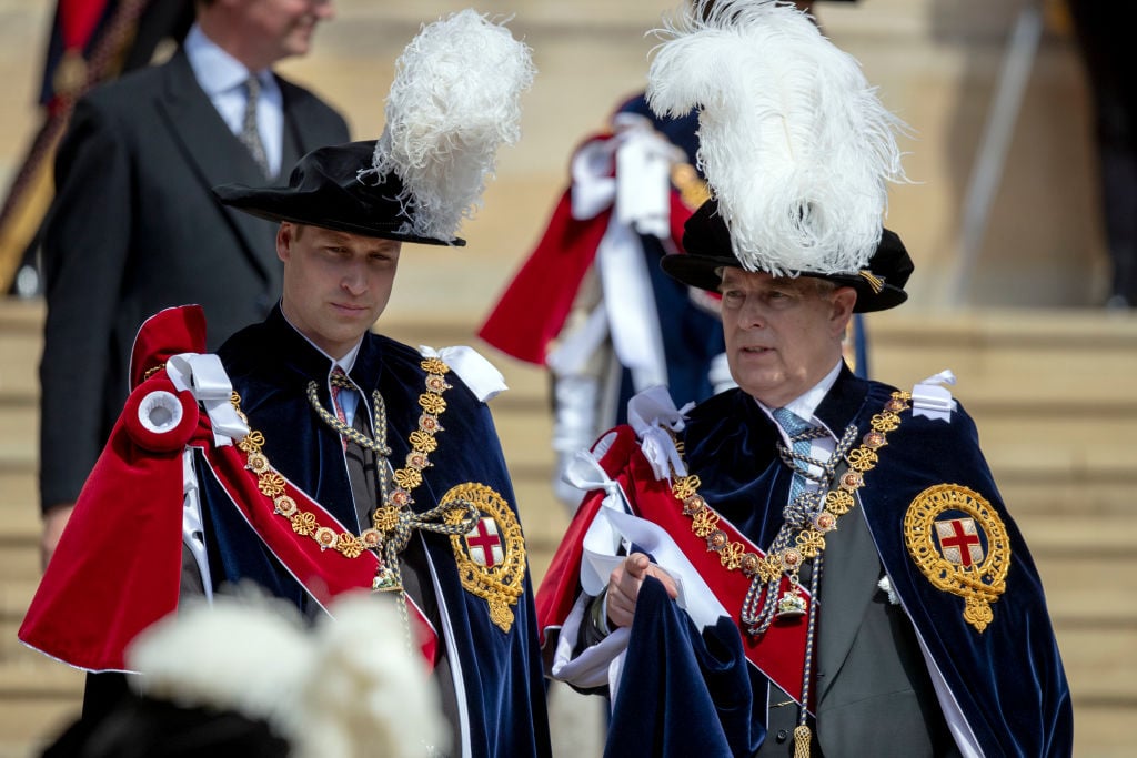 Prince William, Duke of Cambridge and Prince Andrew, Duke of York talk as they leave St George's Chapel after attending the annual Order of the Garter Service in Windsor Castle on June 18, 2018 in Windsor, England. The Order of the Garter is the senior and oldest British Order of Chivalry, founded by Edward III in 1348. The Garter ceremonial dates from 1948, when formal installation was revived by King George VI for the first time since 1805