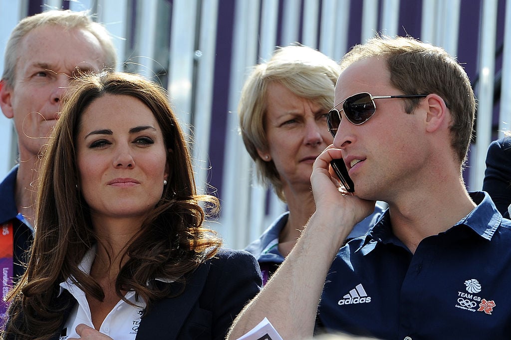 Prince William talks on the phone while attending the 2012 Olympics Games with Kate Middleton