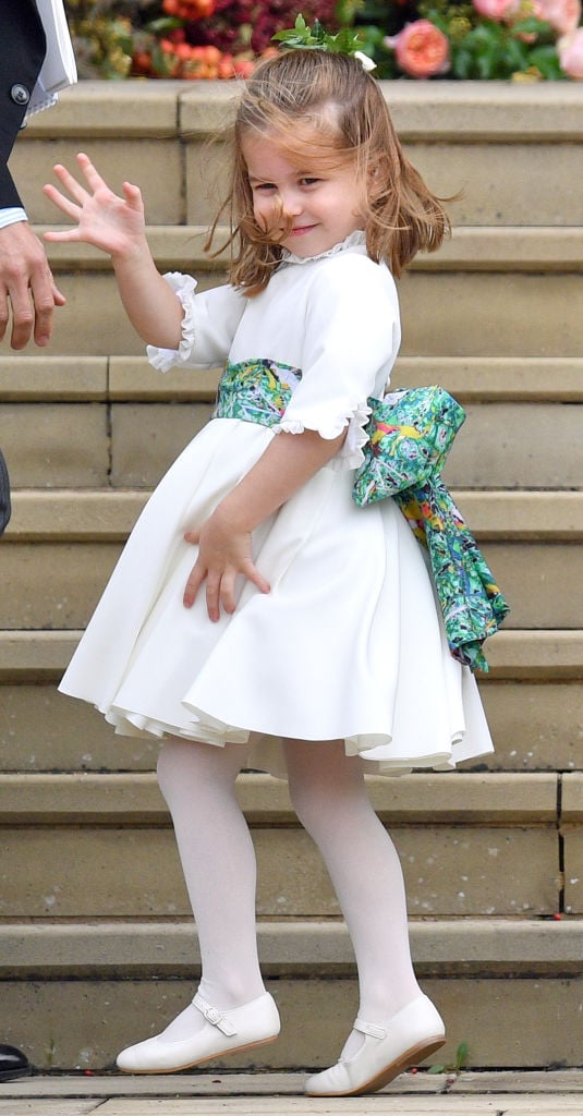 Princess Charlotte waves at the royal wedding of Princess Eugenie and Jack Brooksbank