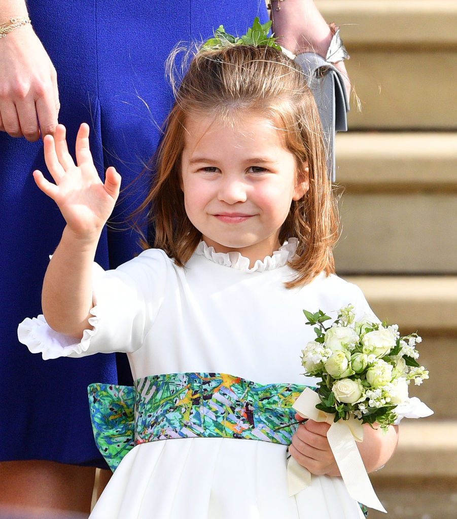 Princess Charlotte waves at the royal wedding of Princess Eugenie and Jack Brooksbank