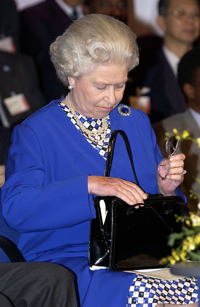 Why Queen Elizabeth II Always Carries Her Purse Everywhere 