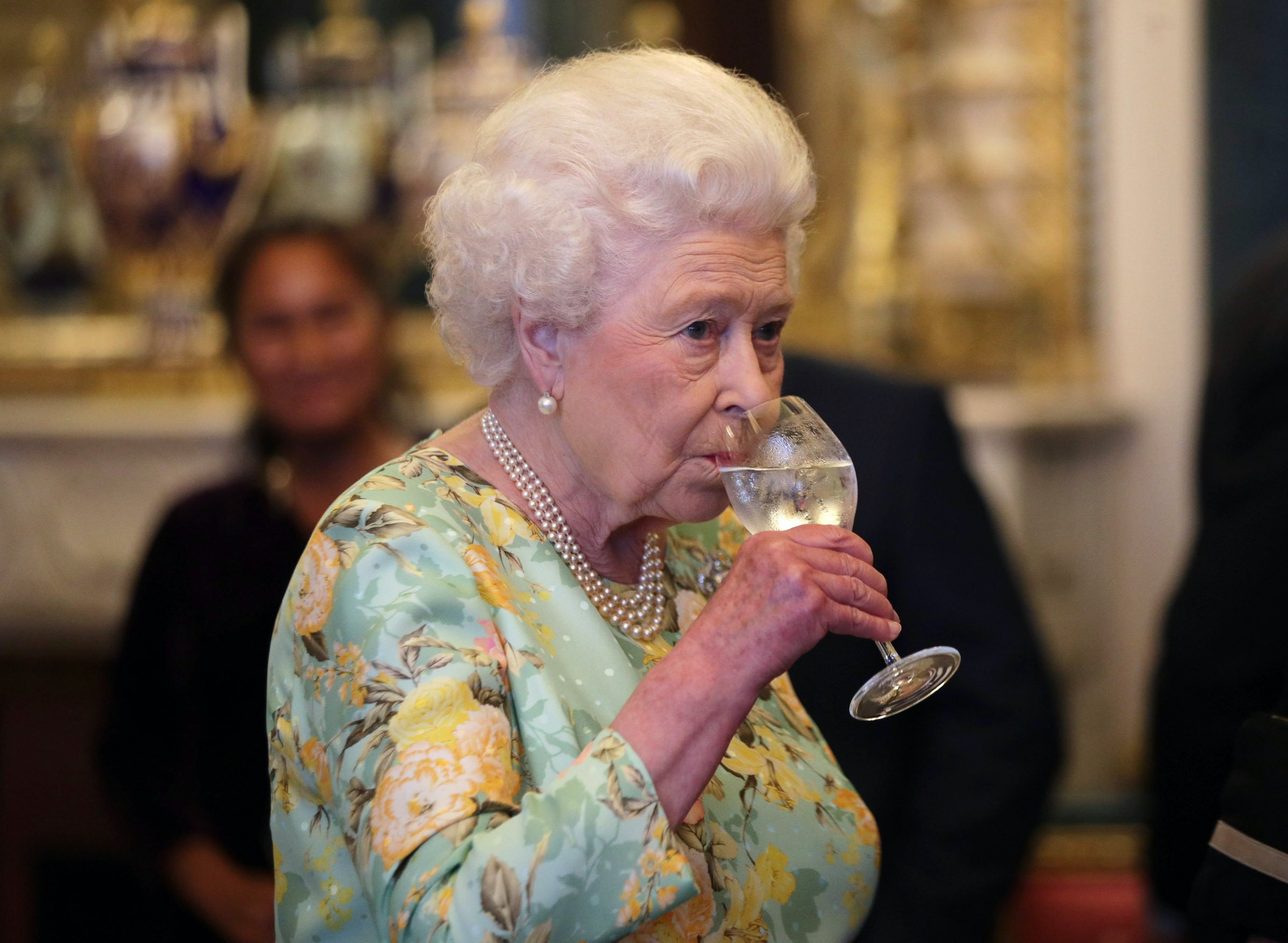 Queen Elizabeth II drinking 