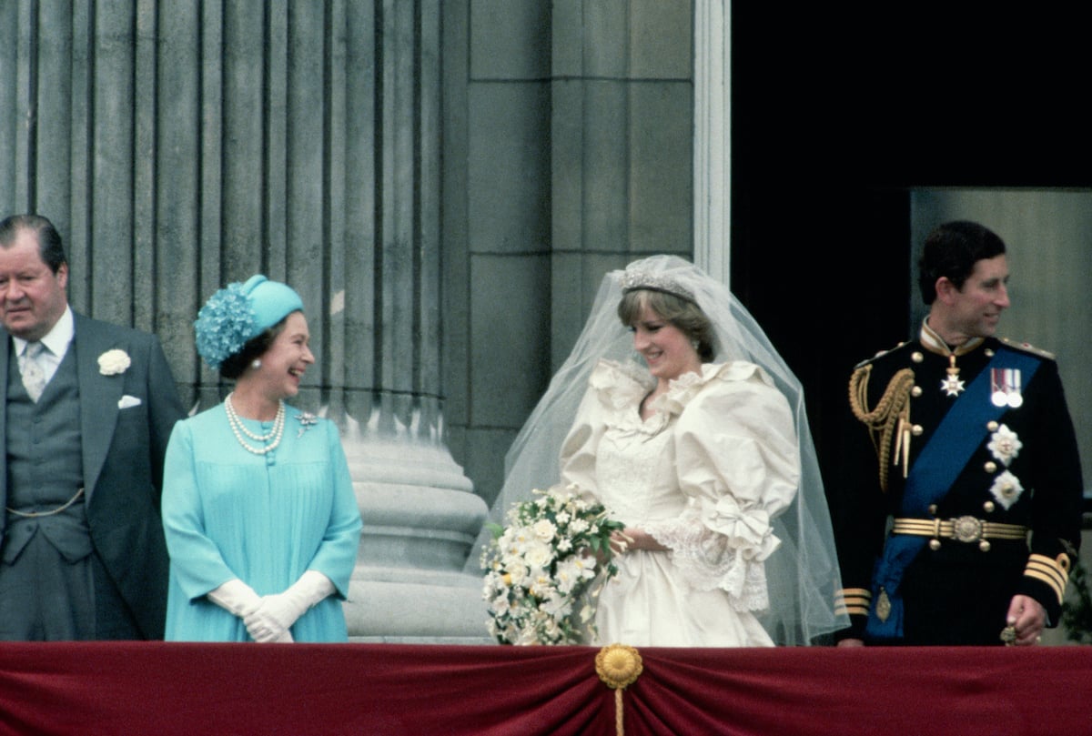 Queen Elizabeth joins the Prince and Princess of Wales on a Buckingham Palace balcony following their London wedding