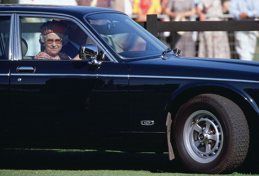 Queen Elizabeth II driving in her car