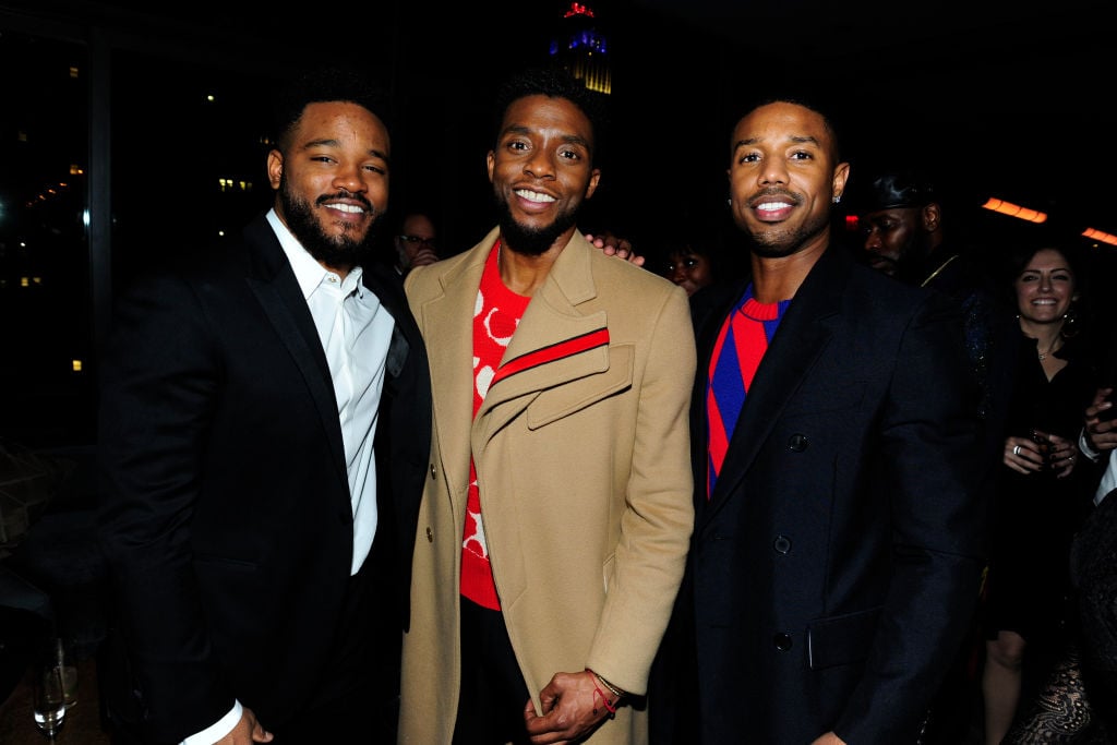 Ryan Coogler, Chadwick Boseman and Michael B. Jordan smiling at the camera