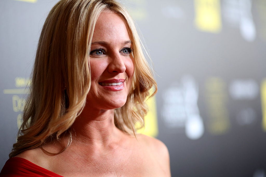 Sharon Case looking away from the camera, smiling