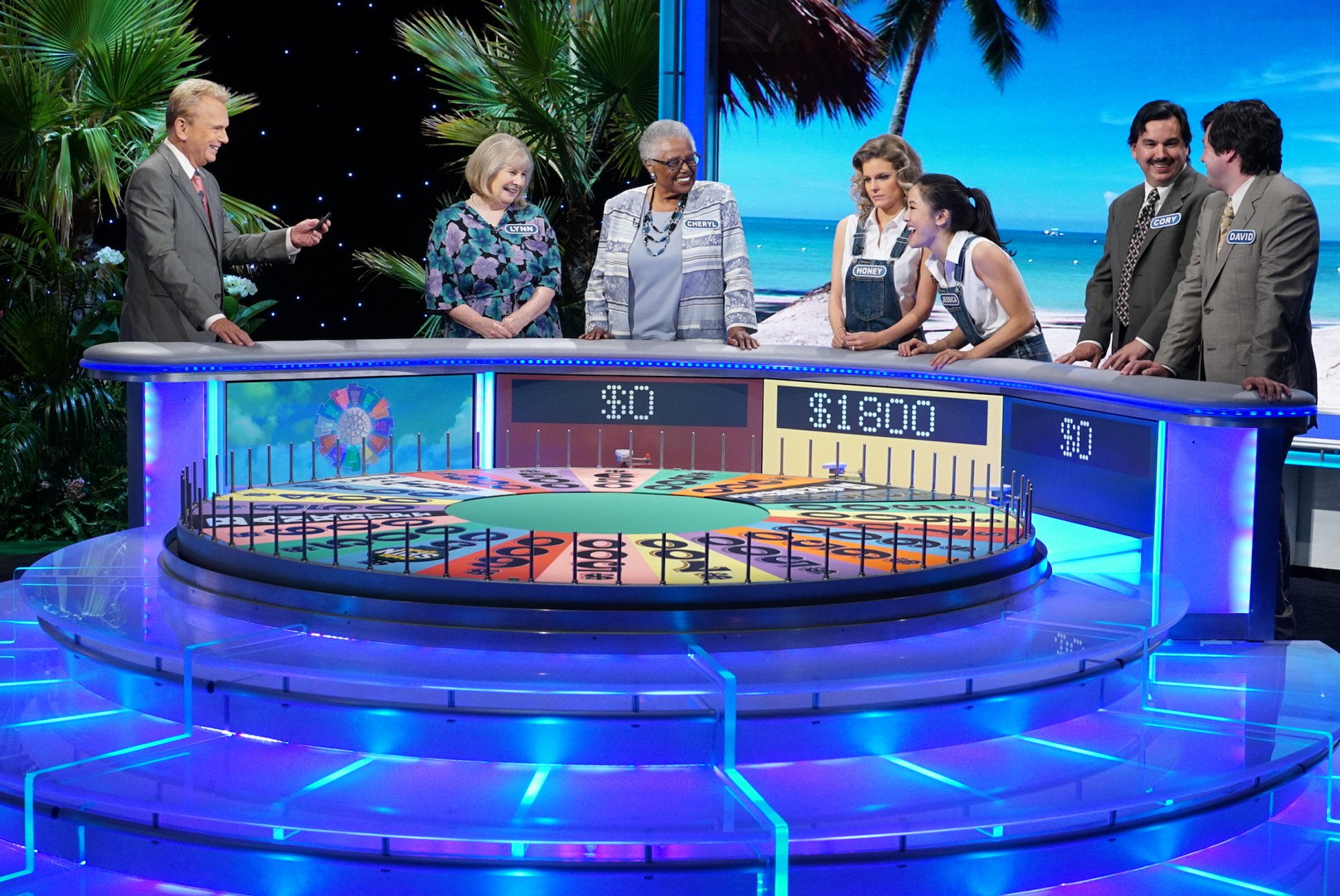 Pat Sajak and contestants on 'Wheel of Fortune'
