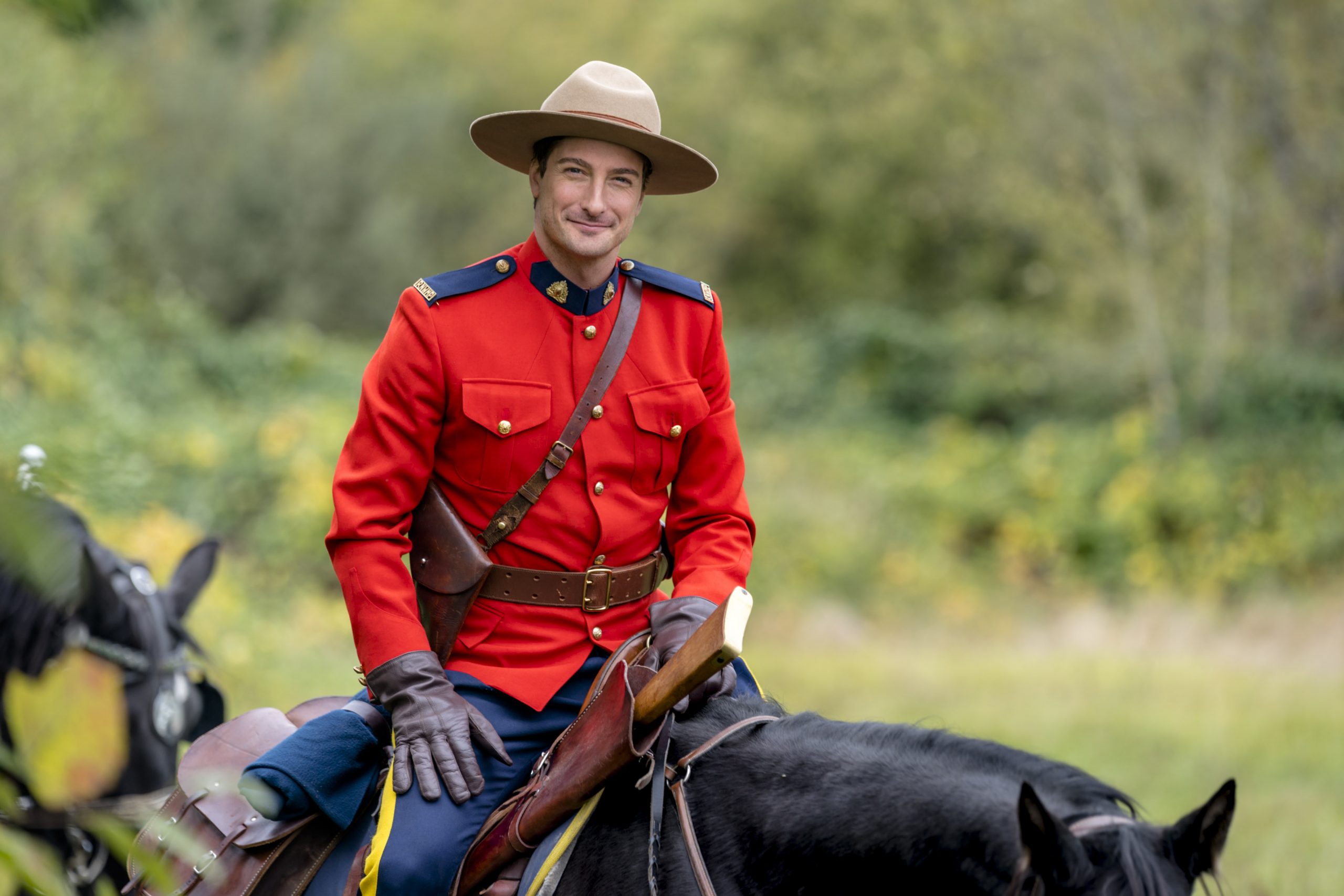 Daniel Lissing, as Jack, riding a horse in When Calls the Heart