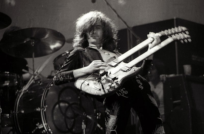 Jimmy Page playing his double-neck guitar onstage