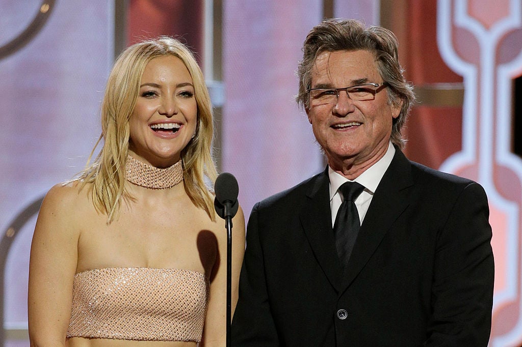 Kate Hudson and Kurt Russell speak onstage during the 73rd Annual Golden Globe Awards at The Beverly Hilton Hotel on January 10, 2016 in Beverly Hills, California. 