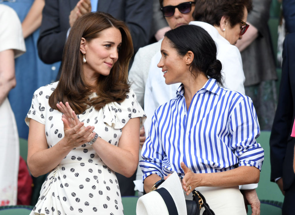 Kate Middleton and Meghan Markle attend day twelve of the Wimbledon Tennis Championships at the All England Lawn Tennis and Croquet Club 