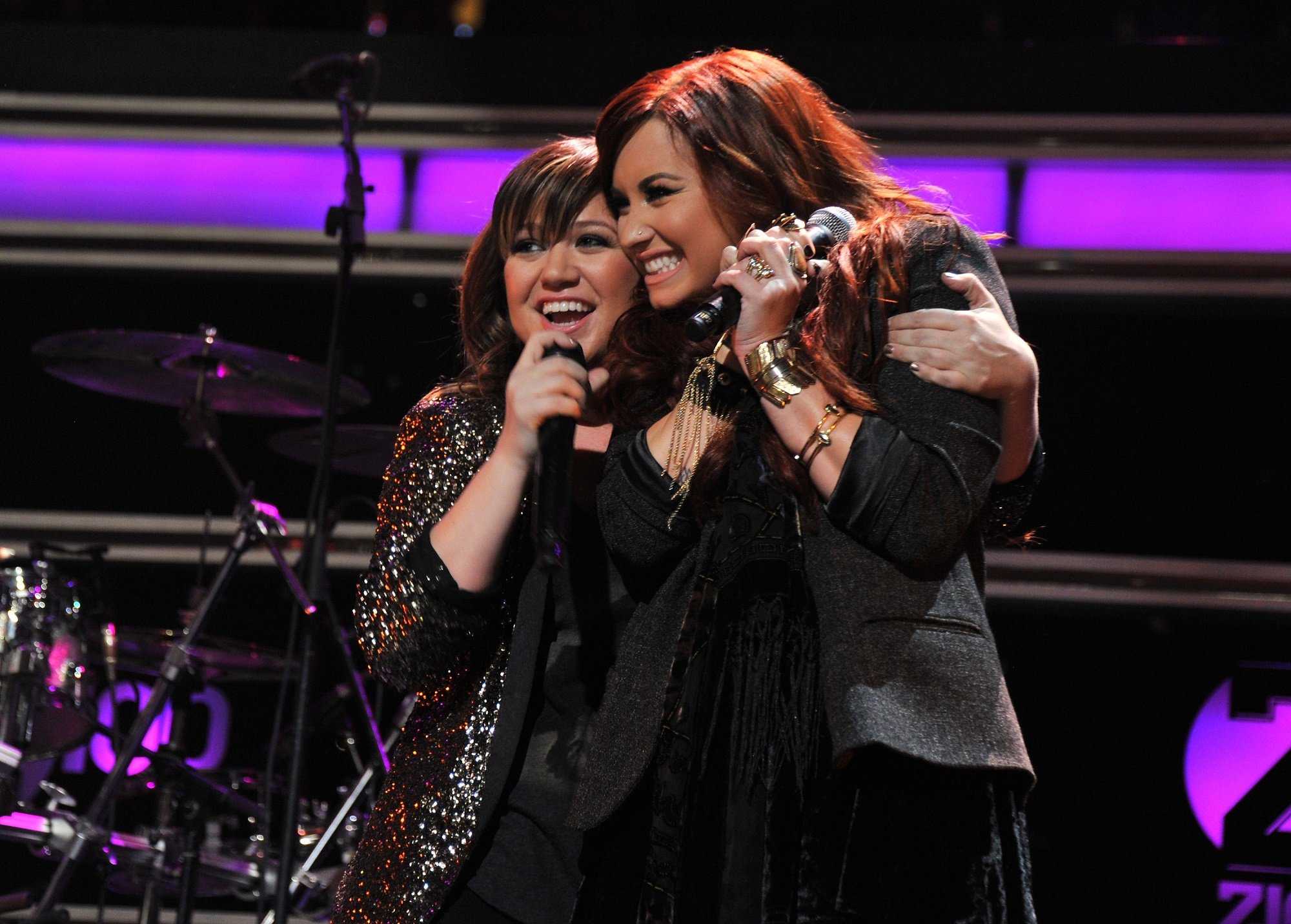Singers Kelly Clarkson and Demi Lovato perform onstage during Z100's Jingle Ball 2011 at Madison Square Garden.