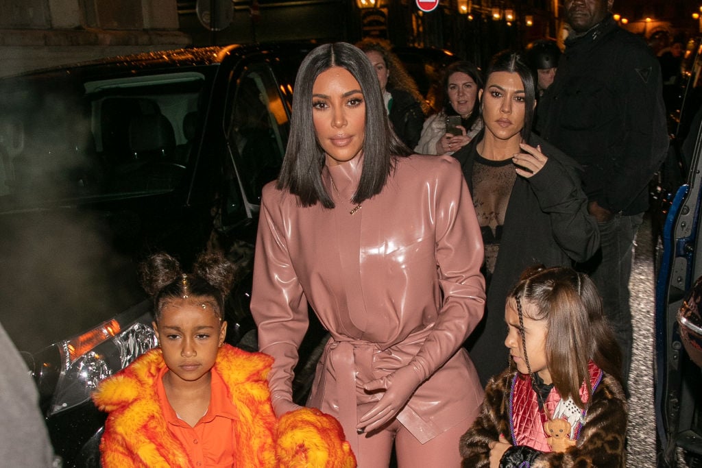 Kim Kardashian West, North West, Penelope Disick, and Kourtney Kardashian arrive at FERDI restaurant in Paris