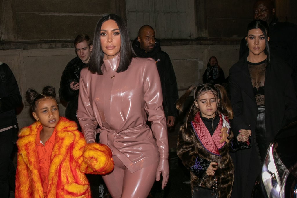 Kim Kardashian West, North West, Penelope Disick, and Kourtney Kardashian arrive at FERDI restaurant in Paris