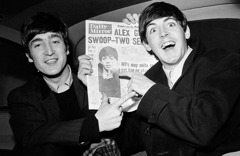 John Lennon and Paul McCartney have a laugh in '63