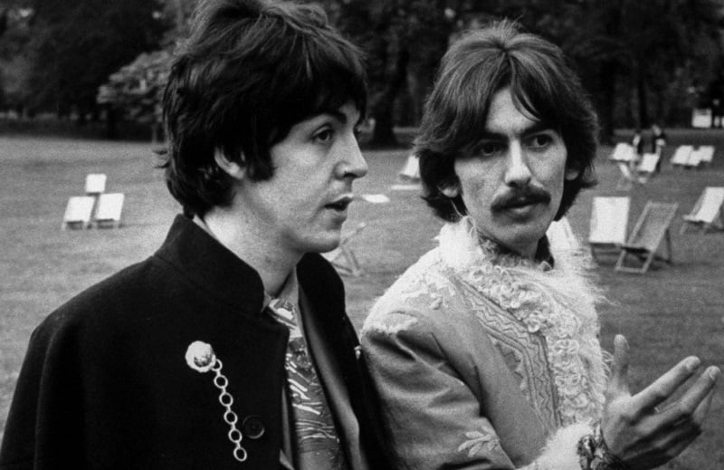 Paul McCartney and George Harrison walking and talking