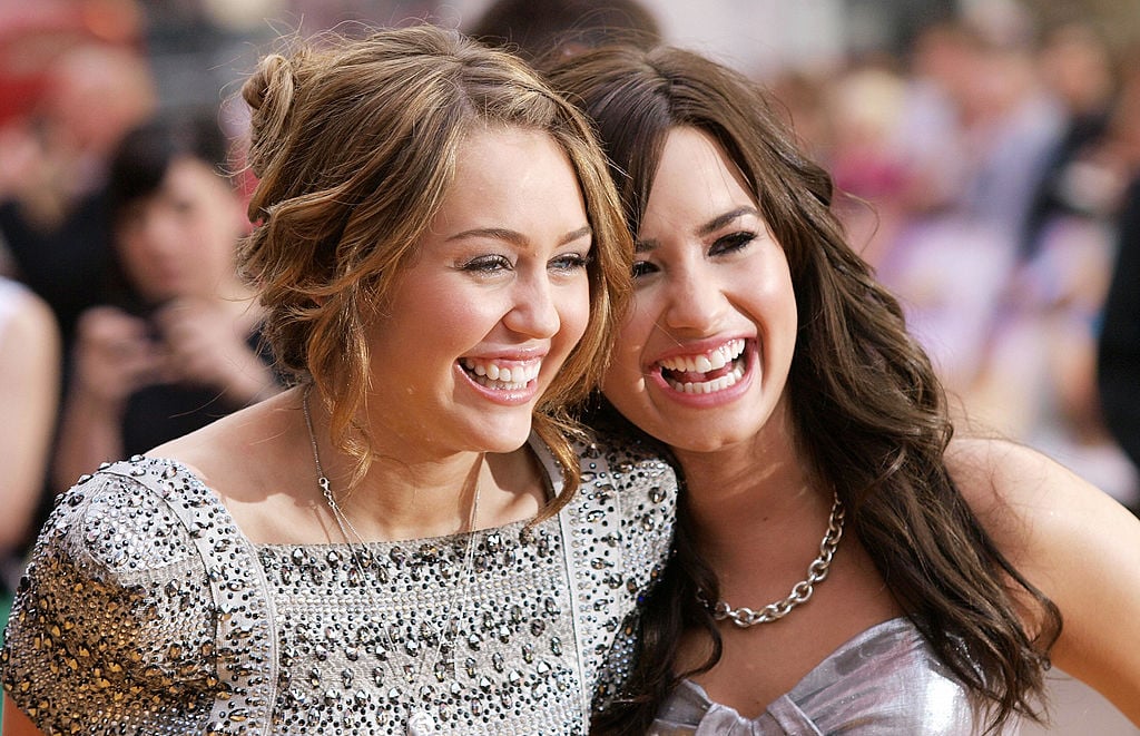 Miley Cyrus (L) and Demi Lovato at the 'Hannah Montana' premiere in London on April 23, 2009