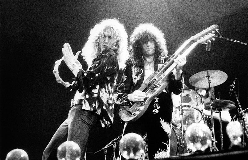 Robert Plant and Jimmy Page performing onstage with Led Zeppelin