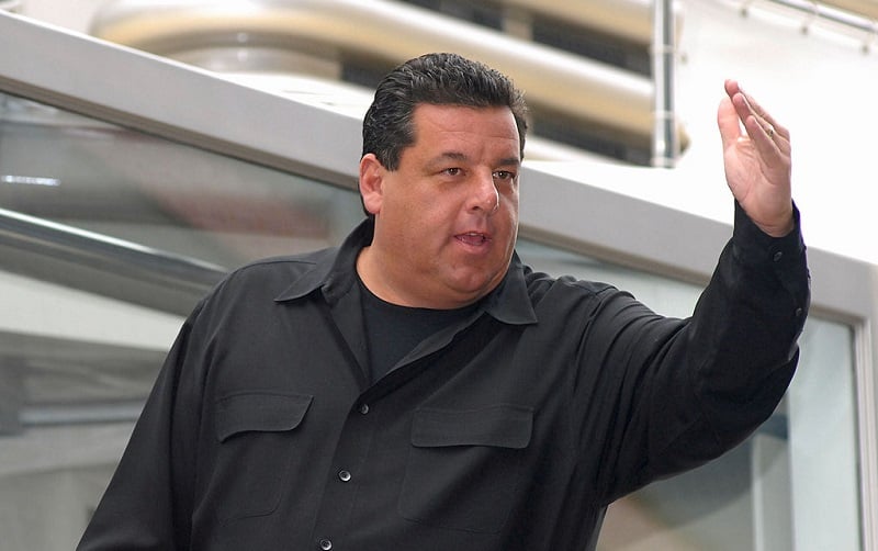 Steve Schirripa gestures from a boat