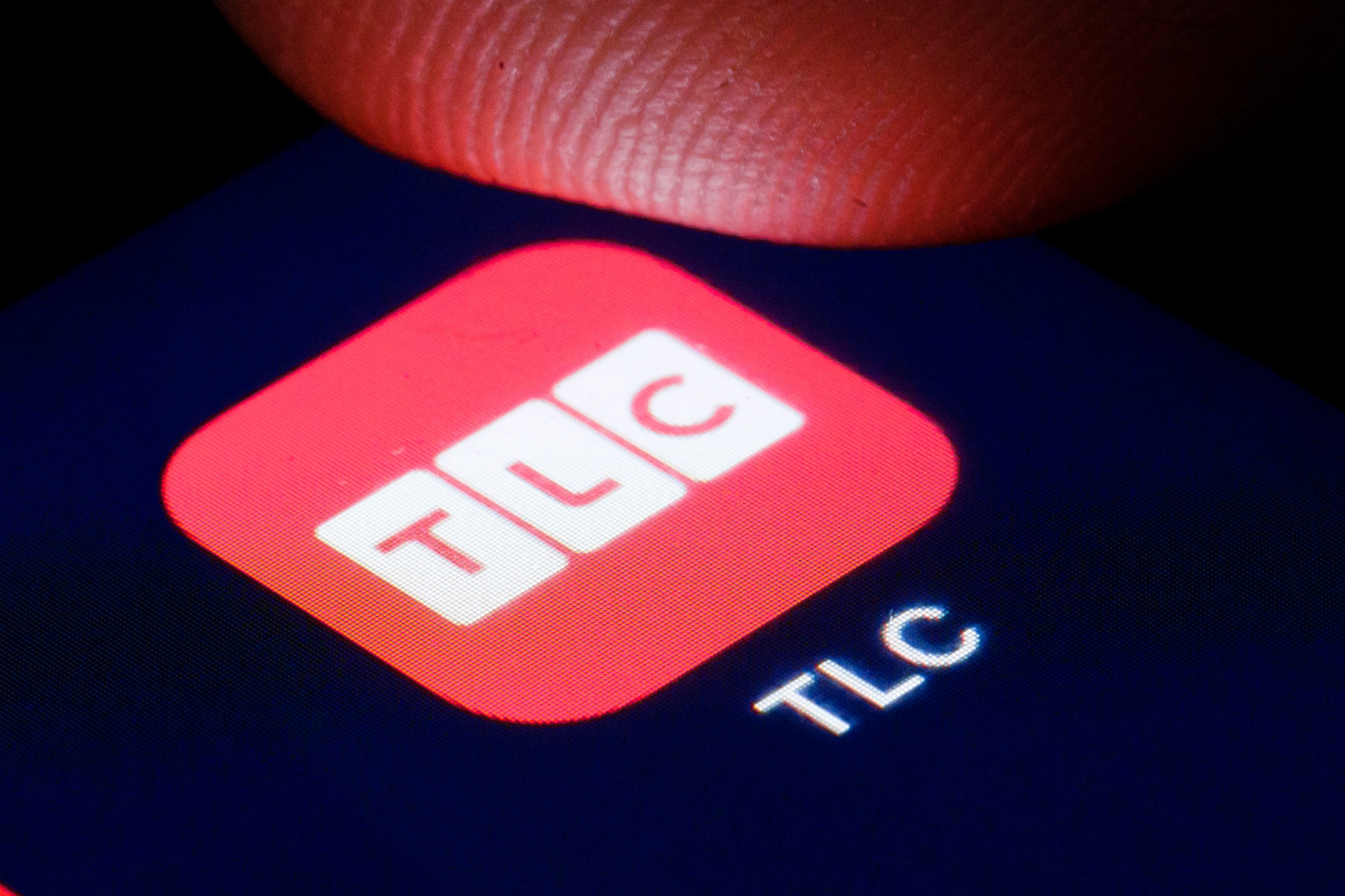 TLC logo on a smartphone