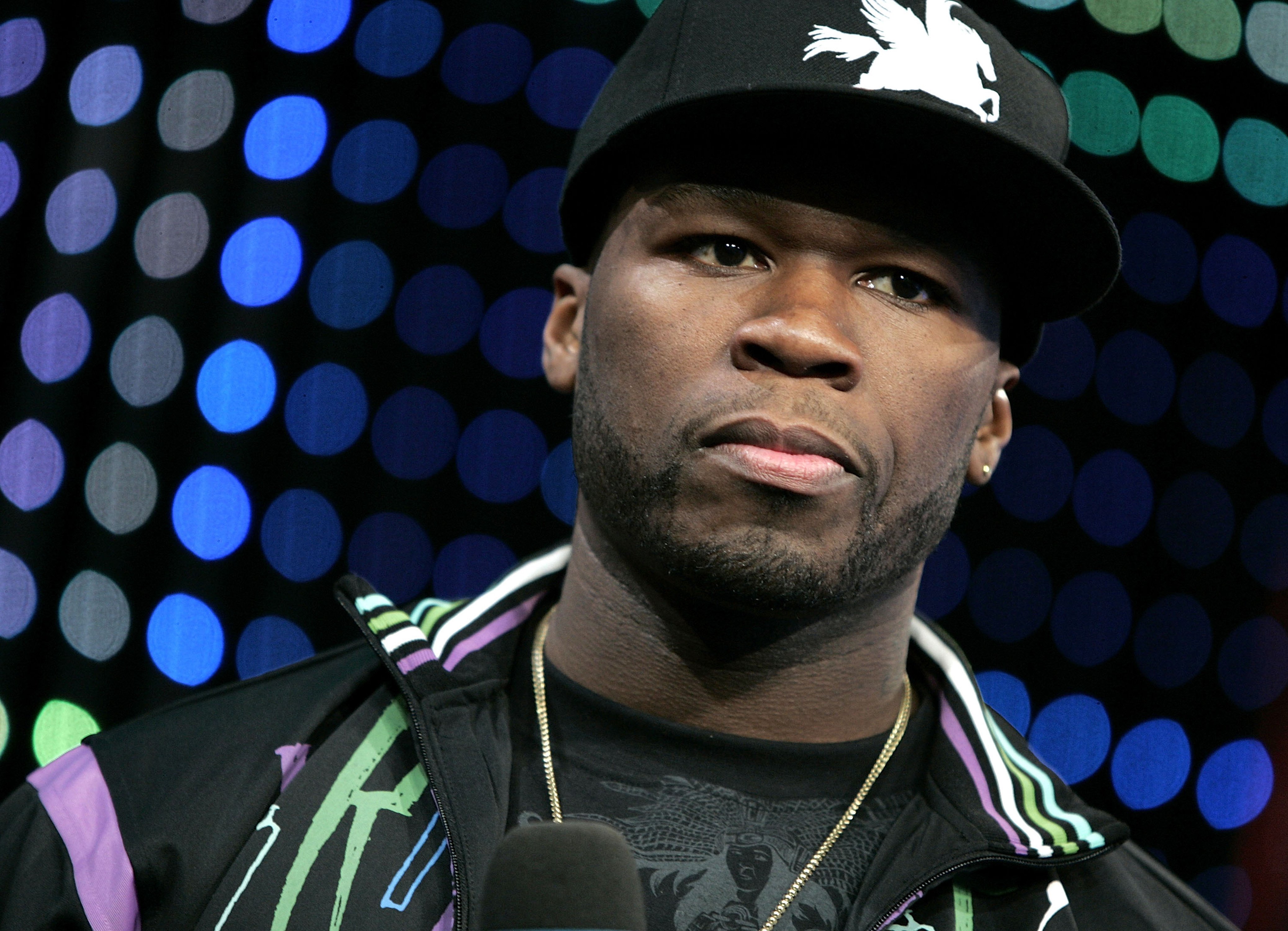 50 Cent wearing a baseball cap